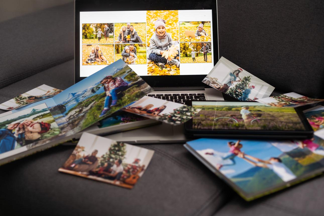 Family photographs displayed on a laptop with a backup hard drive beside it, representing the importance of protecting precious memories.
